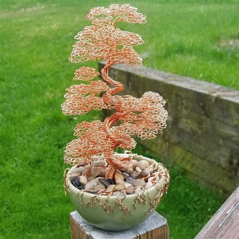 A Copper Wire Bonsai Tree Sculpture In Porcelain Dish With Peppbles A