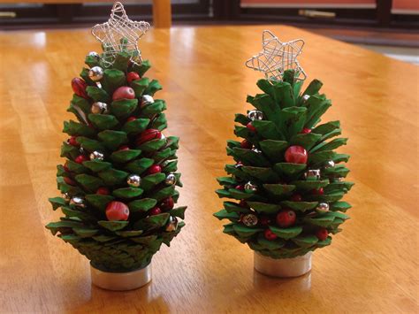 A Little Christmas Tree Craft Project With Fir Cones Paint And Beads
