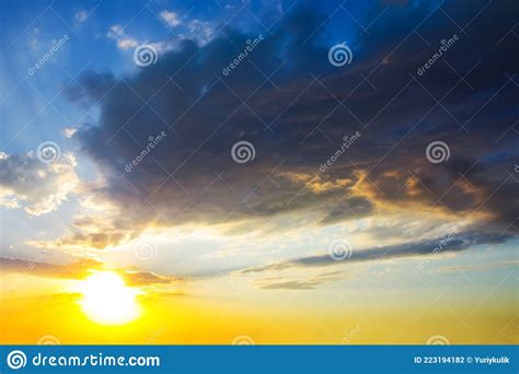 Dramatic Sunset Among Dense Cloudy Sky Stock Photo Image Of Sunlight