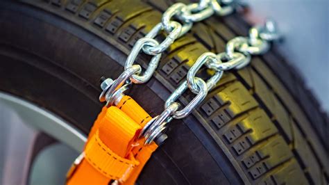 How To Put On Snow Chains On Your Tires Diy Steps The Drive