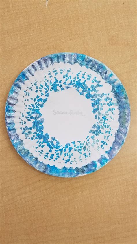 Winter Snowflake Paper Plate Craft With With A Doily Blue Paint And