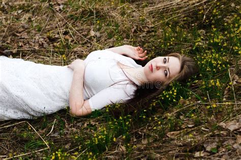 beautiful innocent woman in white dress lying on the grass stock image image of countryside
