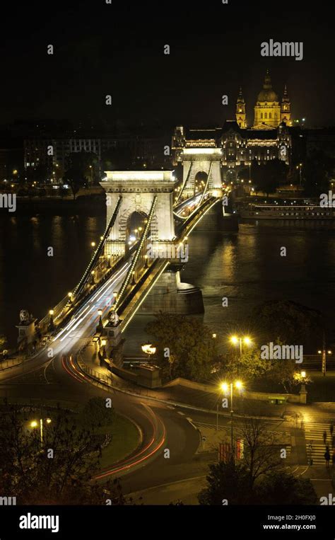 Szechenyi Chain Bridge And St Stephen S Basilica At Night In Budapest