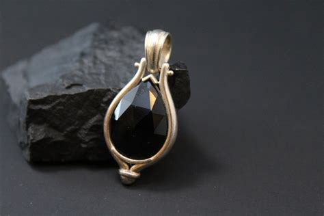 Sterling Silver Faceted Onyx Pear Shaped Pendant