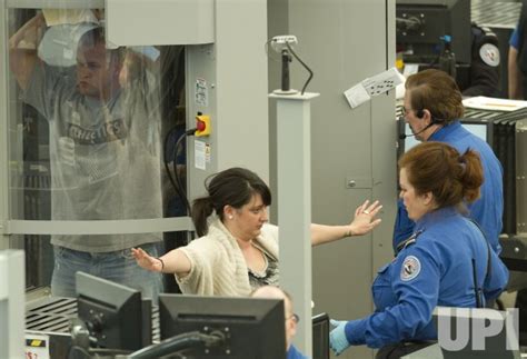 photo tsa conducts full body scans and pat downs at denver international airport