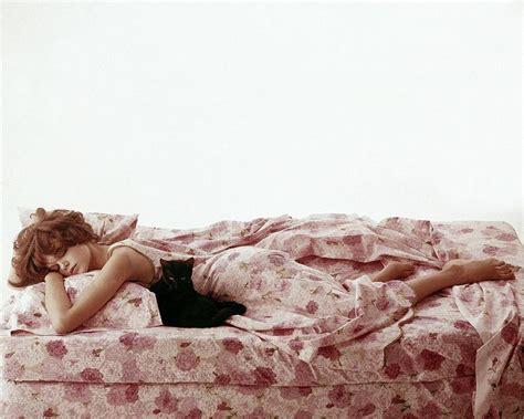 A Model Sleeping On Floral Bed Linens Photograph By Karen Radkai Fine