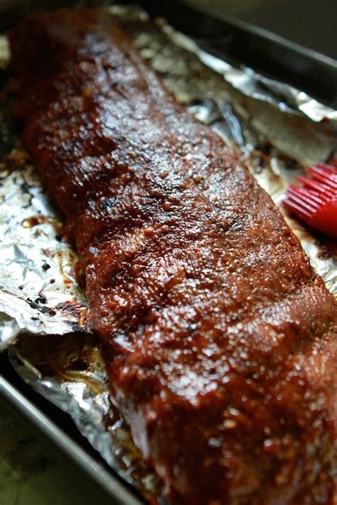 These low and slow bbq ribs are roasted slowly, on low heat that makes amazingly succulent bbq ribs!!seasoned deliciously, these pork ribs are super tender! Easy Oven Baby Back Ribs | Lauren's Latest