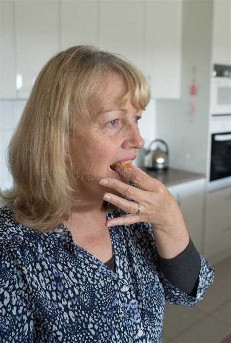 Middle Aged Woman Taking A Bite Of Cake Stock Photo Image Of Hand
