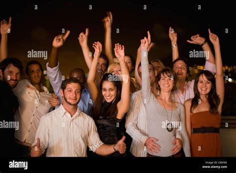 People Cheering At Party At Night Stock Photo Alamy