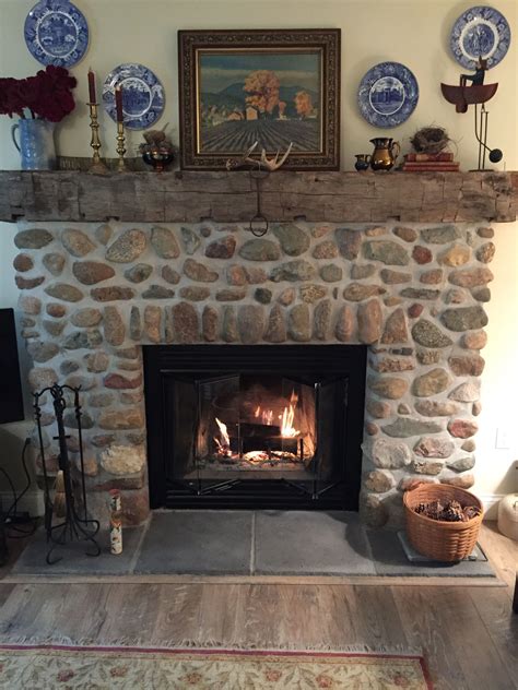 Fieldstone Fireplace With A Hand Hewn Beam For A Mantle The Stones