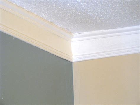 Position a scrap of molding against the wall and ceiling to mark. Weekend Project: How to Create Faux Crown Molding | HGTV