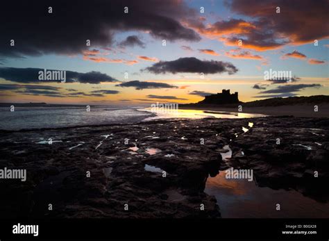 A Winter Sunrise Of The Spectacular Bamburgh Castle On The North East