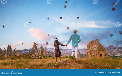 Cappadocia Turkey During Sunrise Couple On Vacation In The Hills Of