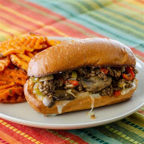 They taste like the classic philly cheesesteaks, but is made with ground beef and served with hamburger buns to resemble sloppy joes. Philly Cheesesteak Sloppy Joes | Real Mom Kitchen