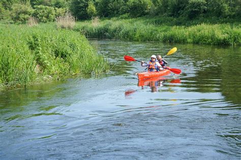 A Man Floating On A Kayak Tourists To Raft On A Canoe On The River