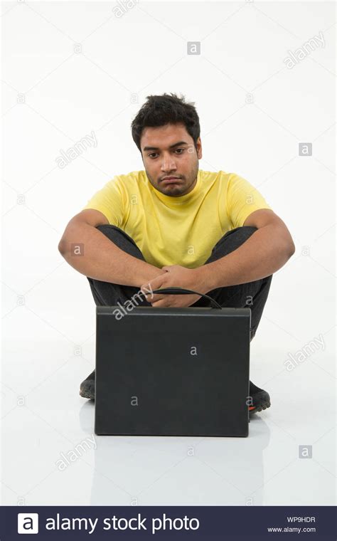 Young Man Looking Sad With Suitcase Stock Photo Alamy