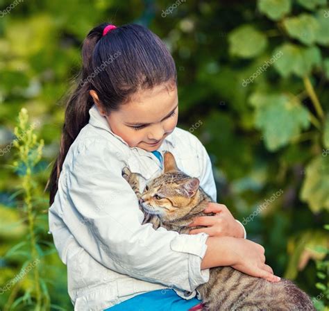 Little Girl Hugging A Stray Cat Stock Photo By ©vvvita 117397820