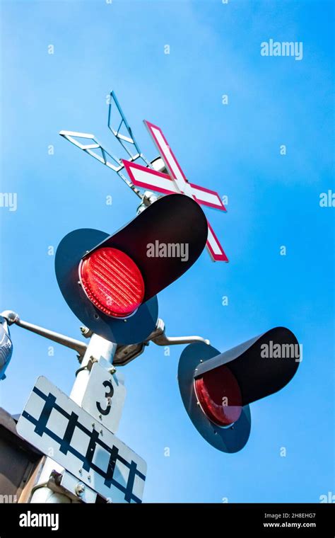 Flashing Red Warning Lights On American Railroad Crossing Stock Photo