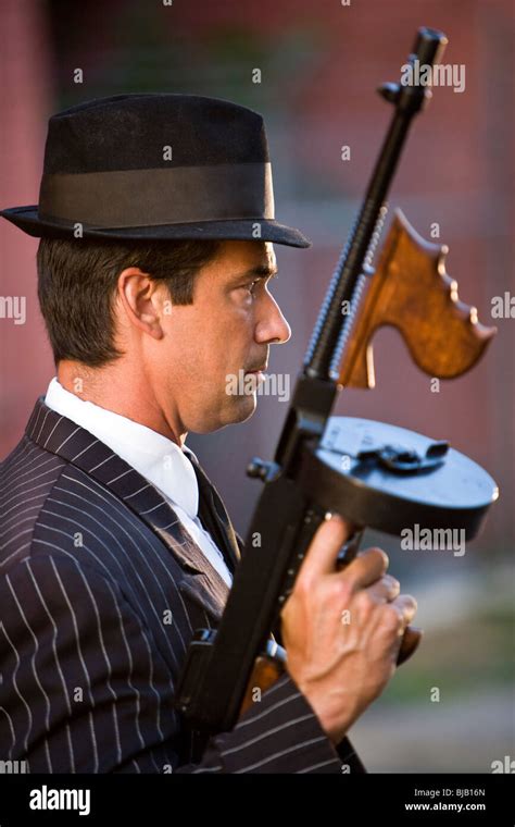 Profile Of Gangster Holding Tommy Gun Stock Photo Alamy