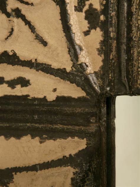 Tin or pressed plastic ceiling tiles can give a room an elegant, unique look. Antique Tin Ceiling Tile Framed Mirror at 1stdibs