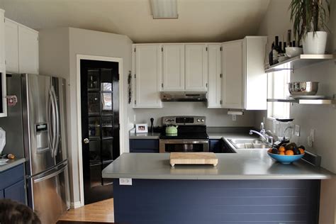 To help you achieve the farmhouse kitchen of your dreams, you may also want to consider soapstone countertops and a wood slat backsplash painted the same shade of red. Navy Painted Base Cabinets - Chris Loves Julia