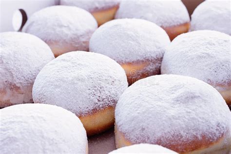 Jelly Filled Doughnuts With Powdered Sugar On A White Background Stock