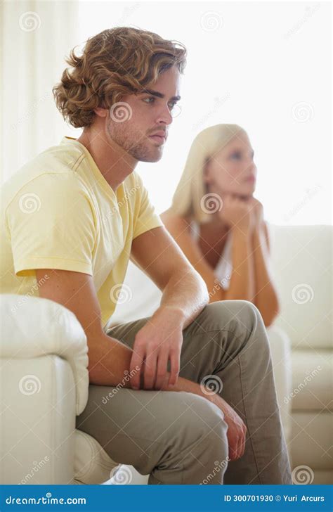 Couple Fight Angry And Divorce Stress On A Sofa With Argument Anxiety Or Cheating Depression