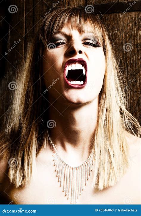 Female Vampire Showing Her Fangs Stock Photos Image 25546063
