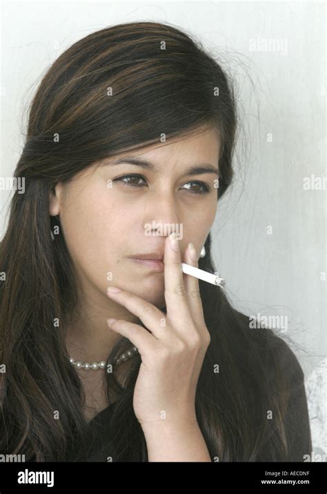 Young Woman Smoking A Cigarette Stock Photo Alamy