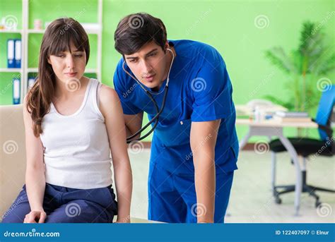 The Female Patient Visiting Male Doctor In Medical Concept Stock Image