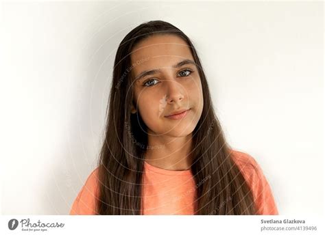 Portrait Of A Beautiful Young Teen Hispanic Girl With Long Brown Health