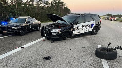 officials woman hit north port police car while driving on i 75