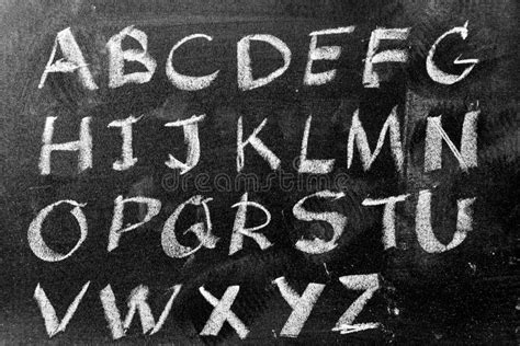 White Chalk Hand Writing In English Capital Letter On Black Board