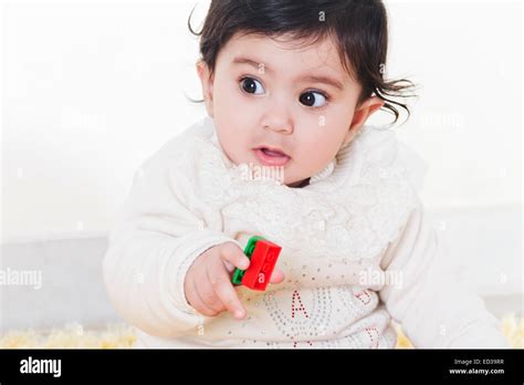 1 Indian Child Baby Playing Toy Stock Photo Alamy