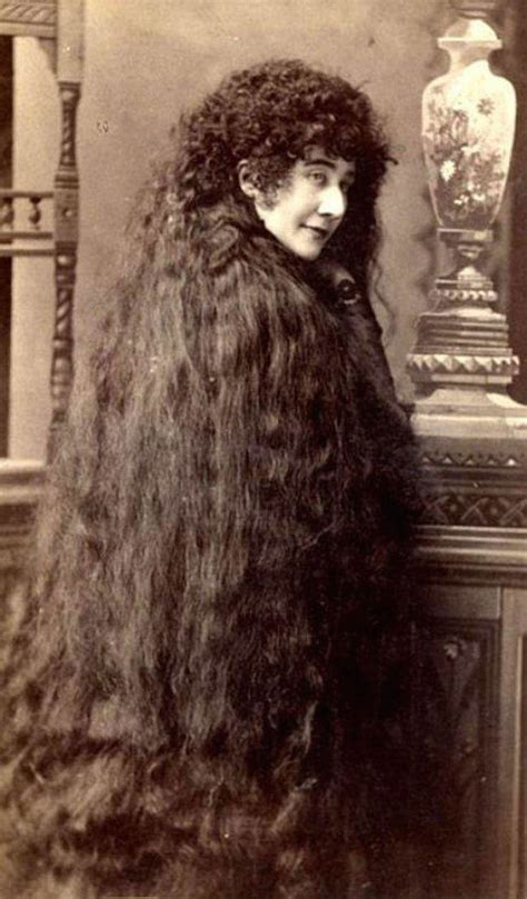 Victorian woman with her hair half down and bangs, both fairly unusual for the time period. Woman With Unbelievably Long Hair On Victorian Era Photos ...