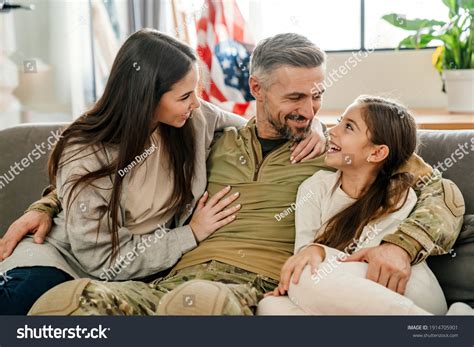 Happy Masculine Military Man Hugging His Stock Photo 1914705901