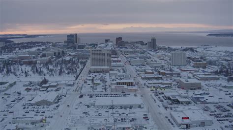 Considered the central business district of anchorage, downtown. 4K stock footage aerial video flying over snow covered ...
