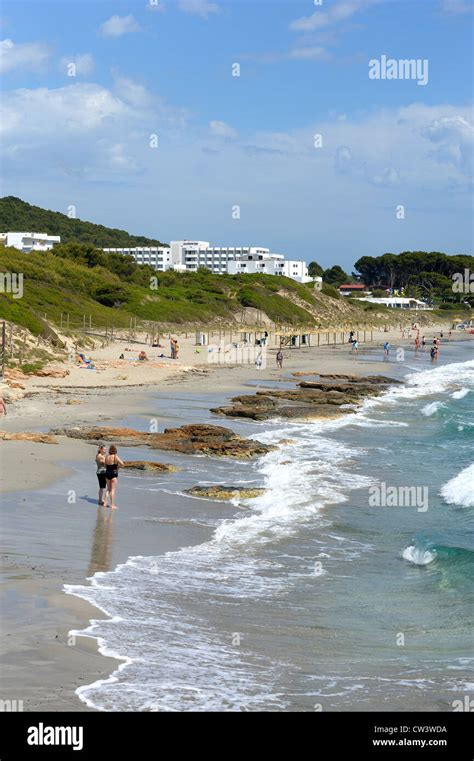 Beach In Santo Tomas Menorca Spain With The Hotel Victoria Playa In The Upper Frame Of The Image