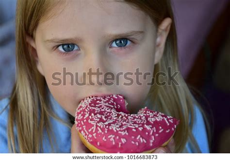 Baby Eats Donut Stock Photo Edit Now 1016683873