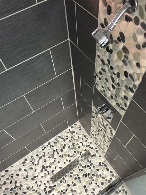 Mosaic tile is often used for bathroom flooring because of the superior grip that this tile's seaming provides for both wet and dry feet. 26 nice pictures and ideas of pebble bath tiles