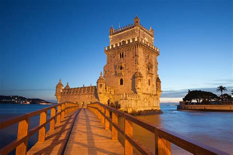 Belem Tower In Lisbon Illuminated At Night Photograph By Artur Bogacki