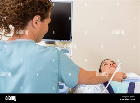 Nurse Scanning Female Patients Neck Stock Photo Alamy