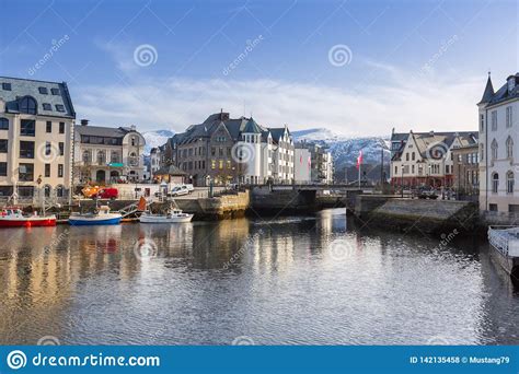 Architecture Of Alesund Town Reflected In The Water Norway Stock Photo