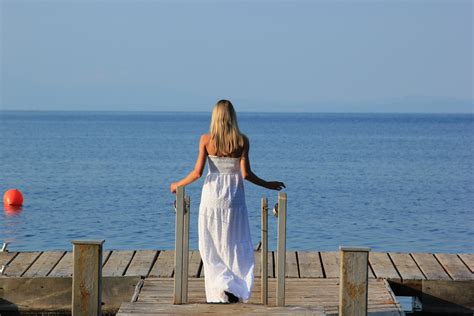 free images beach sea coast ocean girl sun vacation sitting blue blonde dress