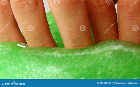 The Guy Is Having Fun With A Toy Slime With His Fingers Pressing On The Slime Stock Video