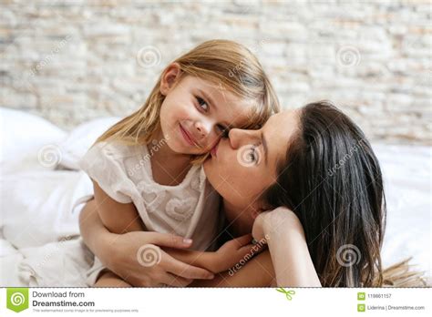 Mother Kissing Her Daughter Stock Image Image Of Caring Bedtime