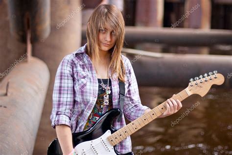 Stylish Brunette Girl With Guitar — Stock Photo © Denisovd 10727878