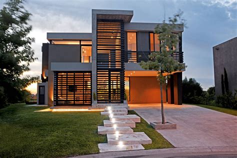 A Modern House With Stairs Leading Up To It