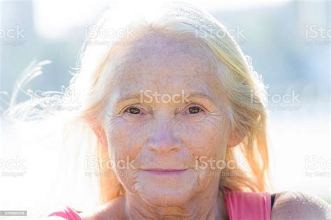 Portrait Of Modern Attractive Mature Woman Without Makeup In Sunshine