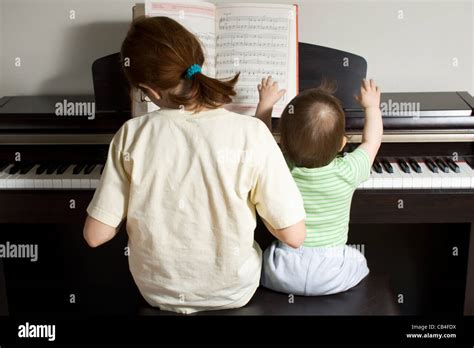 Children Playing Piano Back View Stock Photo Alamy
